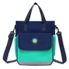 Bolso para estudiante de primaria nuevo clase de entrenamiento bolsa de trabajo portátil doble espalda bandolera tres usos mochila infantil logo personalizado