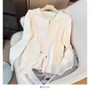 Cardigan Suéter Tricotado Solto com Capuz Novo Outono 2025 Feminino Zíper Duplo Manga Longa Versátil Jaqueta Top Cor Pura