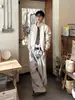 Pantalones casuales de traje a rayas con botones para hombre y mujer, nuevos de otoño vintage versátiles holgados que estilizan con caída y pierna ancha