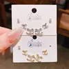 2026 Juego de Pendientes Personalizado en Forma de C Ojo de Serpiente Verde Circonita Seis Piezas con Acabado de Alta Gama, Aguja de Plata, Juego de Tres Pares de Pendientes de Lujo Ligero