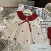 Ropa Infantil Estilo Coreano 2026 Nuevo Verano Conjunto de Dos Piezas para Niñas: Top a Cuadros Bordado con Cuello de Muñeca y Shorts Florales