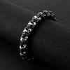 El símbolo del poder misterioso pulsera de calavera de acero de titanio retro personalidad de la moda para hombre pulsera de fantasma de acero inoxidable