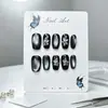 Uñas press-on cortas cuadradas-redondas estilo ojo de gato negras con accesorios florales plateados hechos a mano, geniales y elegantes, piezas de arte de uñas terminadas desmontables