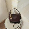 Bolsa de Mão Matizada Retro de Nicho Outono e Inverno Feminina 2026 Nova Versátil Bolsa Transversal Exquisite Super Quente Pequena Bolsa Tote de Mão