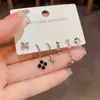 Pendientes de borla con cadena de trébol de cuatro hojas, estilo minimalista europeo y americano, diseño único y elegante, venta al por mayor