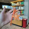 Nuevo Llavero de Estrella de Cinco Puntas Estilo Piel, Estrella Simulada, Colgante de Corazón para Bolso Femenino, Decoración para Mochila de Estudiante Venta al por Mayor
