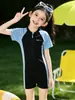Traje de baño de secado rápido con protección solar para mujer, Traje de baño de una pieza infantil de verano 2026, Nuevo traje de baño conservador para niñas de secundaria, Traje de baño para niñas