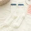 Calcetines de coral fleece para mujer invierno más terciopelo más gruesos calcetines de piso para el hogar cálidos de invierno calcetines para dormir esponjosos venta al por mayor suaves