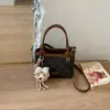 Bolsa de balde de nicho de alta qualidade para mulheres, nova bolsa versátil de outono de 2026, bolsa transversal popular para ir ao trabalho