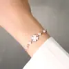 Pulsera de perlas súper dulce con una vibra suave, joyería con forma de corazón, helado blanco crema, pulsera de circonita de trébol de cuatro hojas para mujer