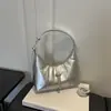 Diseño moderno y único 2026 verano nueva moda simple versátil alto valor texturizado hombro bolsa de albóndiga