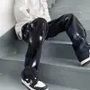 Estilo vibe europeo y americano jeans negros de pierna recta holgados para hombre marca de moda ins hip hop costuras rudo guapo calle alta pantalones largos