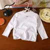 Camiseta de Moda para Niñas 2026 Nudo de Mariposa Manga Larga Primavera y Otoño Elegante Ropa Base Infantil Top Exterior Estilo Coreano Encaje