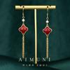 Pendientes de trébol de cuatro hojas festivos de Año Nuevo rojo de estilo chino con diseño original de nicho, pendientes cheongsam de tendencia nacional retro