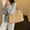 Bolso de mano retro de lunares transfronterizo para el día a día, nueva colección otoño 2026, bolso de mano grande moderno y a la moda para mujer