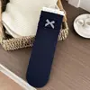 Calcetines de encaje de lunares grises de moda para mujer, otoño e invierno, con accesorios de lazo, calcetines elegantes hasta la pantorrilla