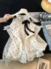Blusa de gasa de manga larga con lunares estilo francés, cuello halter y perlas para mujer, modelo nuevo 2026, top holgado de hombros descubiertos, color albaricoque, otros