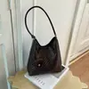 Bolso tejido vintage de alta gama transfronterizo para mujer, nuevo bolso de hombro de moda 2026 para ir al trabajo, bolso tipo cubo de mano de gran capacidad