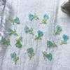 Joyería para uñas Tulipán de alta calidad permeable al hielo diseño de nicho aretes material luminoso para usar en la uña parche francés para uñas