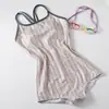 Trajes de baño para mujer al por mayor, modelo nuevo 2026, bañador de una pieza conservador para damas con copas en el pecho, adecuado para piscinas y aguas termales, traje de baño de natación