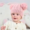 Otoño e invierno nuevo gorro de punto para niños con doble pompón Europeo y americano en stock color sólido color cálido gorro de lana para bebé