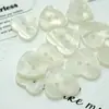 Ventas directas desde el fabricante de origen: Botones de resina imitación concha, botones de perla de dos agujeros en forma de corazón, botones decorativos hechos a mano para suéteres y cárdigans