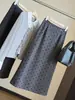 Moderna y elegante falda midi de mezcla de lana con lunares para mujer 2026 Otoño Nueva Cintura Alta Adelgazante Abertura Trasera Ceñida Recta