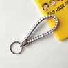 Llavero creativo llavero de cuerda de cuero cordón para llaves colgante de joyería cordón tejido fábrica de cuerda de cuero venta al por mayor