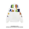 Sudadera con capucha bordada con letras, de estilo americano, personalizada y colorida, para hombres y mujeres, adecuada para primavera, otoño e invierno, una prenda exterior única y moderna.