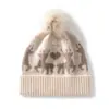 Nueva colección de otoño e invierno: Gorro de punto sencillo y versátil con pompón, hecho de cachemira, con un diseño de bloques de color con un pequeño motivo de ciervo, que ofrece un look moderno, casual y cálido.