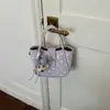 Bolso tipo cubo retro de moda estilo coreano transfronterizo para mujer, nuevo modelo de verano 2026, bolso de hombro de alta apariencia, bolso de mano y bolso cruzado