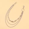 Tendencia de moda europea y americana personalidad remache de doble cabeza cadena de resorte cilíndrico costura de cadena cadena de metal multicapa para pantalones joyería genial
