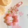 Llavero Colgante de Coche con Lazo de Perlas Electrochapado Color Caramelo Pintura para Hornear Hebilla Pequeña para Puerta Accesorios de Perla Bolsa