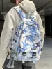 Mochila moderna con graffiti para hombre, adecuada para estudiantes de secundaria, preparatoria y universidad; Mochila de viaje elegante de gran capacidad para mujer