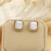 Collar y Anillo de Venta Caliente Transfronterizo Europeo y Americano Aretes de Perlas Heterosexuales de Moda Aretes de Mujer de Alta Gama