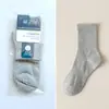 Calcetines de empaque individual para hombre, calcetines de algodón para hombre de color liso para otoño e invierno, calcetines para hombre al por mayor, calcetines deportivos de tubo largo para hombre