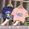 Ropa para niños para niños, camiseta de manga larga de retazos, imitación de dos piezas, camiseta base de algodón puro para niños mayores, nuevo estilo de top para primavera y otoño 2026