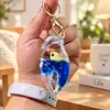 Llavero Creativo Portátil con Colgante Líquido del Mundo Marino, Juguete Delfín de Arena Movediza para Alivio del Estrés, Regalo de Cumpleaños