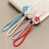 Estilo Ins flor fresca trançada cordão curto universal para capa de celular Apple iphone pingente de corda de mão anti-perda