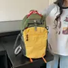 Mochila Coreana de Bloques de Color de Nicho para Mujer 2026 Nueva Mochila Pequeña Casual para Estudiantes Viajes Mochila de Montañismo Escolar con un Toque de Alta Gama