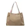 Bolso casual nuevo de gran capacidad para mujer, bolso de hombro de moda para el trabajo, bolso tote de lona simple y versátil, bolsa de compras, moderno