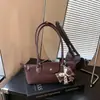 Bolso de hombro cruzado de moda de verano 2026 estilo coreano, nicho de moda versátil para mujer, bolso simple para el antebrazo para el día a día