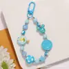 Nueva Cadena de Cuentas Chapada en Color Llavero Colgante de Muñeca de Dibujos Animados Accesorio de Cara Sonriente Colorida de Doble Cara Decoración para Funda de Auriculares Bolsa