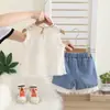 Ropa Linda para Niñas 2026 Nuevo Comercio Exterior Verano Sin Mangas Collar Hueco Encaje de Niña Shorts de Mezclilla Conjunto de Dos Piezas