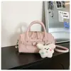 Bolso de mano texturizado de alta calidad con patrón de lichi para mujer, nuevo y versátil 2026, bolso tipo almohada de lujo ligero para hombro y cruzado