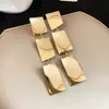 Pendientes Metálicos Plegables Brillantes Transfronterizos Europeos y Americanos con un Diseño de Moda, Personalidad Exagerada y una Sensación de Lujo Ligero de Alta Gama