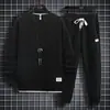 Traje de punto gofre para hombre, nuevo conjunto de dos piezas casual deportivo de manga larga y pantalón largo para primavera y otoño, atuendo moderno y elegante