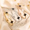 Moda europeia e americana senso de alta qualidade trevo de quatro folhas madrepé preto e branco aço titânio pulseira feminina micro-cravejada diamante não desbota enfeites de mão acessórios de personalidade