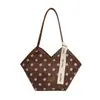 Bolsa de gran capacidad para mujeres que van al trabajo, nueva bolsa de mano de lunares de moda 2026, bolsa de hombro debajo del brazo simple y elegante