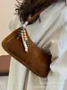 Bolsa de Grande Capacidade Feminina Outono e Inverno Design de Nicho 2025 Nova Bolsa Casual Simples de Ombro/Axila Bolsa Baguete para o Trabalho